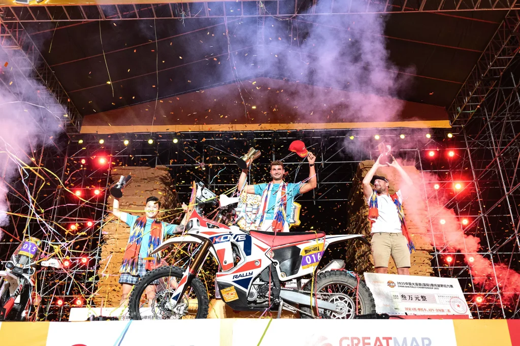 KOVE Rally Factory Team celebrating championship on stage at 2025 Dahaidao Rally